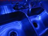 Polished Steel Sink Reflecting Blue Lights