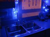 Blue Kitchen With Streetlight-Lit Window Shades, Lynn