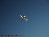 Crossed Paths: Climbing Jet and Contrail, Medford, Mass.
