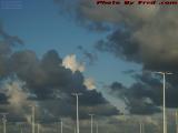 Parking Lights Rising Toward Multi-Shaded Clouds, Sunrise