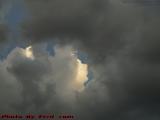 Uplifted Sunlit Face Through a Hole in the Clouds